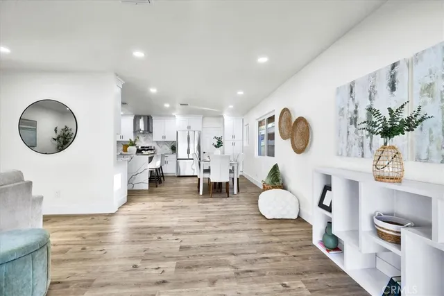 a living room with furniture and a chair
