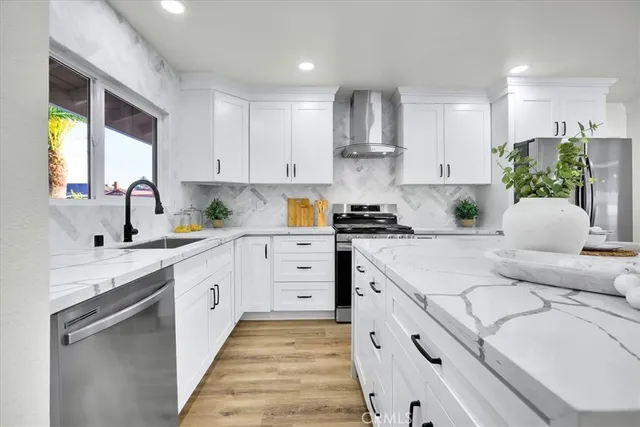 a kitchen with cabinets and appliances