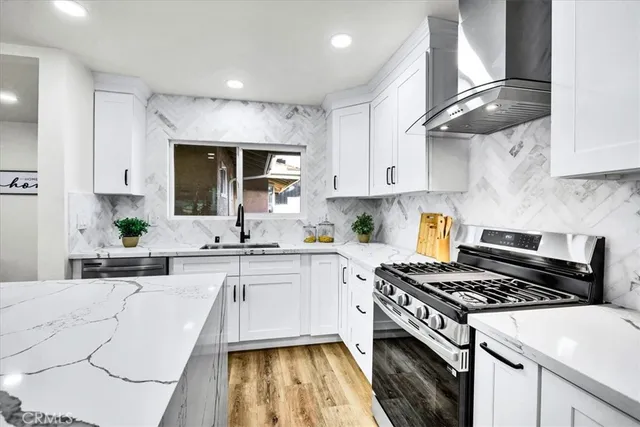 a bedroom with a large bed and a couch