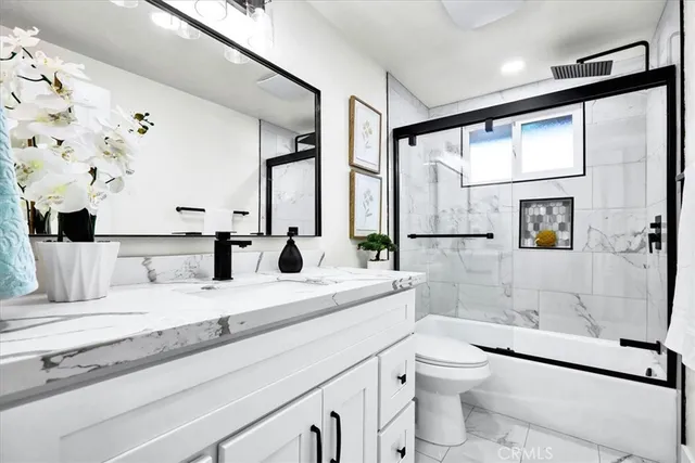 a bed room with a bed and windows