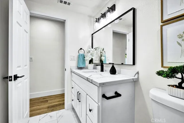 a bed room with a bed and a lamp