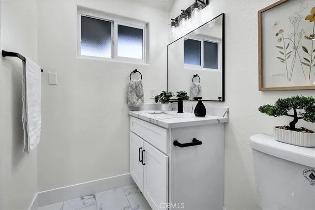 a bed room with a bed and a lamp