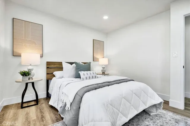 a bedroom with bed and a window