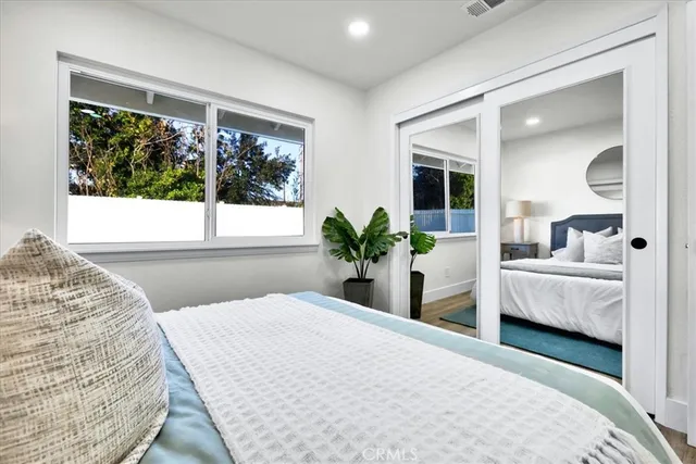 a view of a big room with refrigerator and chandelier