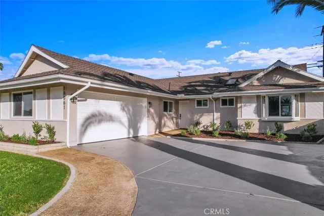 a front view of house with yard outdoor seating and barbeque oven