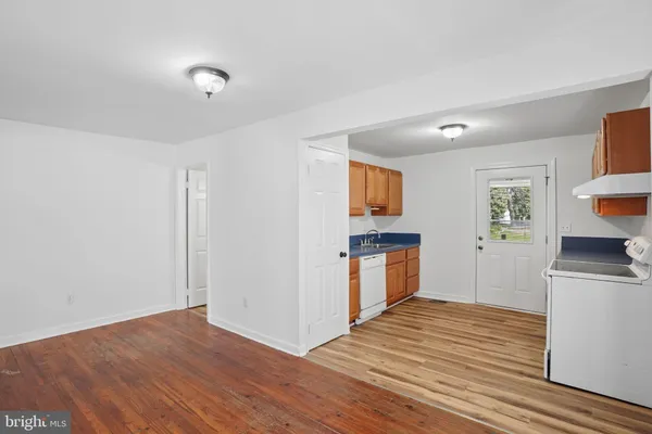 a view of a kitchen from the hallway