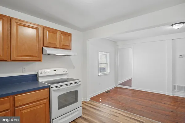 a kitchen with a stove and a microwave