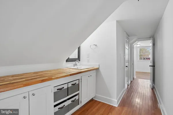 a view of a kitchen from the hallway