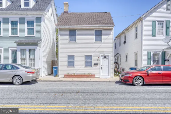 a car parked in front of a house