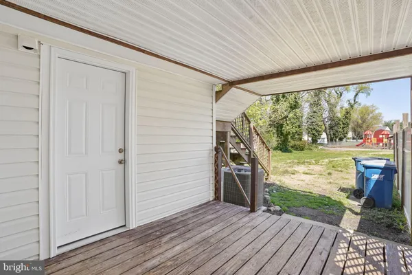 a view of a porch with wooden floor and outdoor space