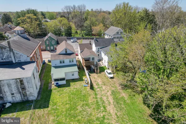 a aerial view of a house with a yard