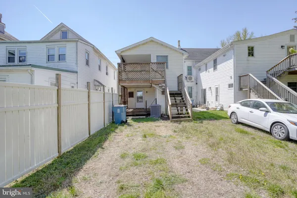 a view of a car park in front of house