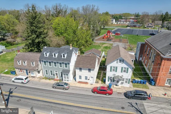 a view of multiple houses with a street