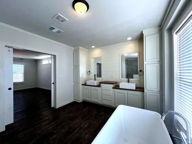 a view of kitchen with furniture and wooden floor