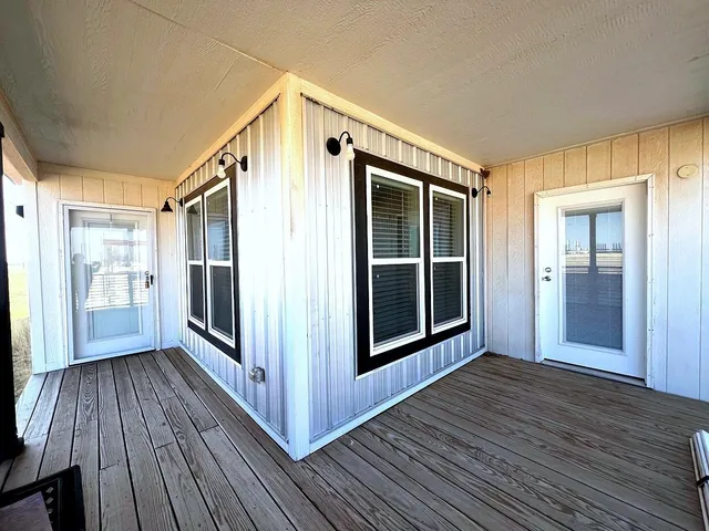 a view of front door and wooden floor