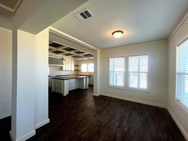 a view of kitchen with furniture and wooden floor