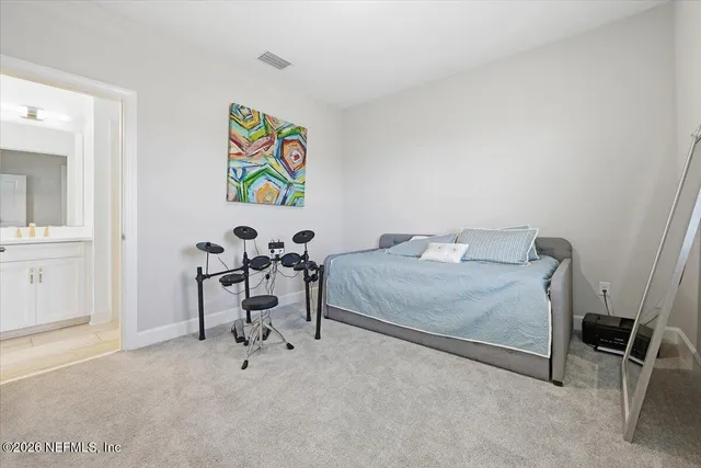 a bedroom with a bed and a table in it