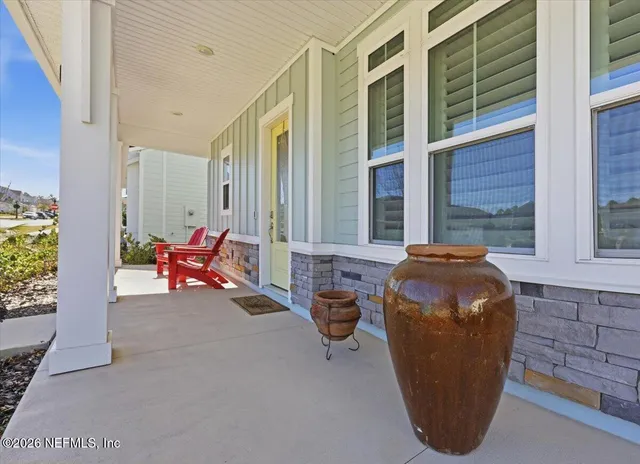 a view of a two chairs in the balcony