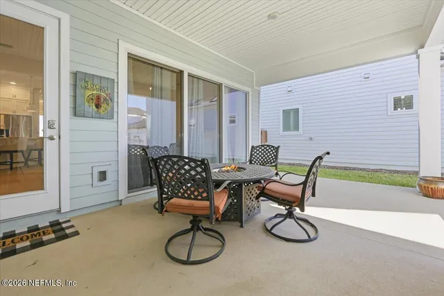 a view of a livingroom with furniture and a window