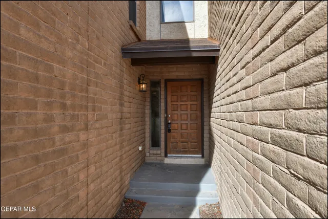 a kitchen with a sink window and cabinets
