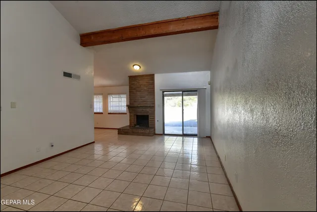 a kitchen with stainless steel appliances granite countertop a refrigerator stove and microwave