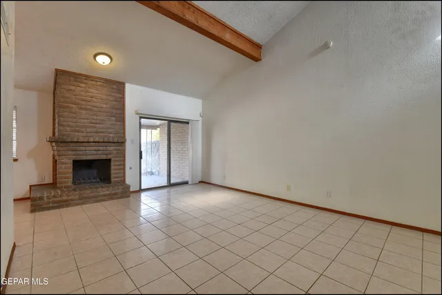 a kitchen with granite countertop wooden cabinets stainless steel appliances and a sink