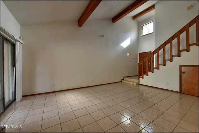 a view of staircase with lots of frames on wall