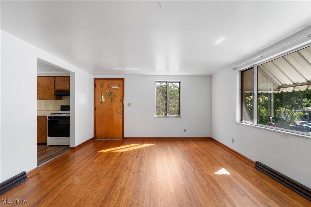 56321-56323 Riley Road Bridgeport, OH 43912 - Photo 27 of 40 Unfurnished living room featuring hardwood / wood-style floors