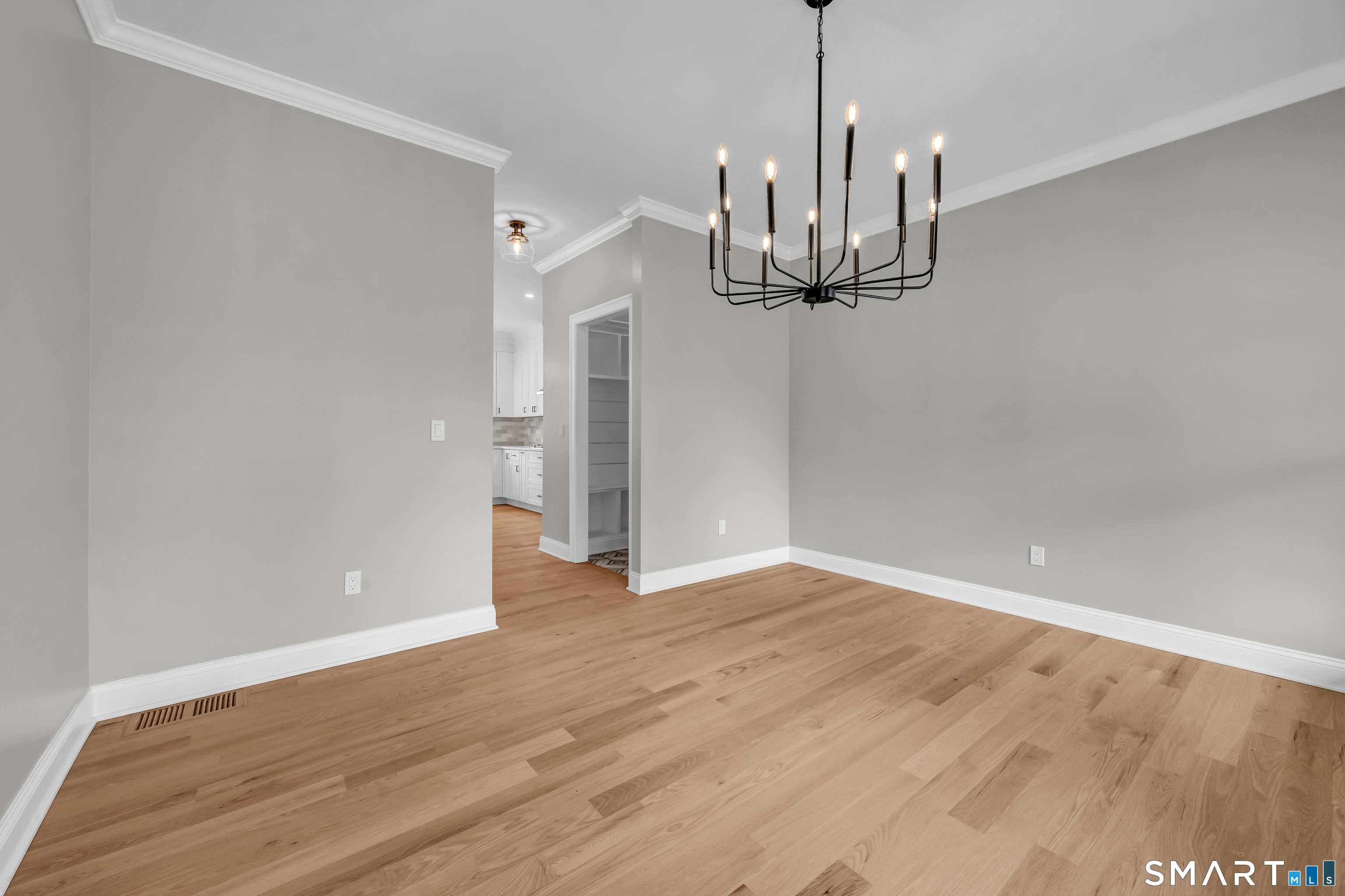 1427 Monroe Turnpike Monroe, CT 06468 - Photo 13 of 41 a view of empty room with wooden floor