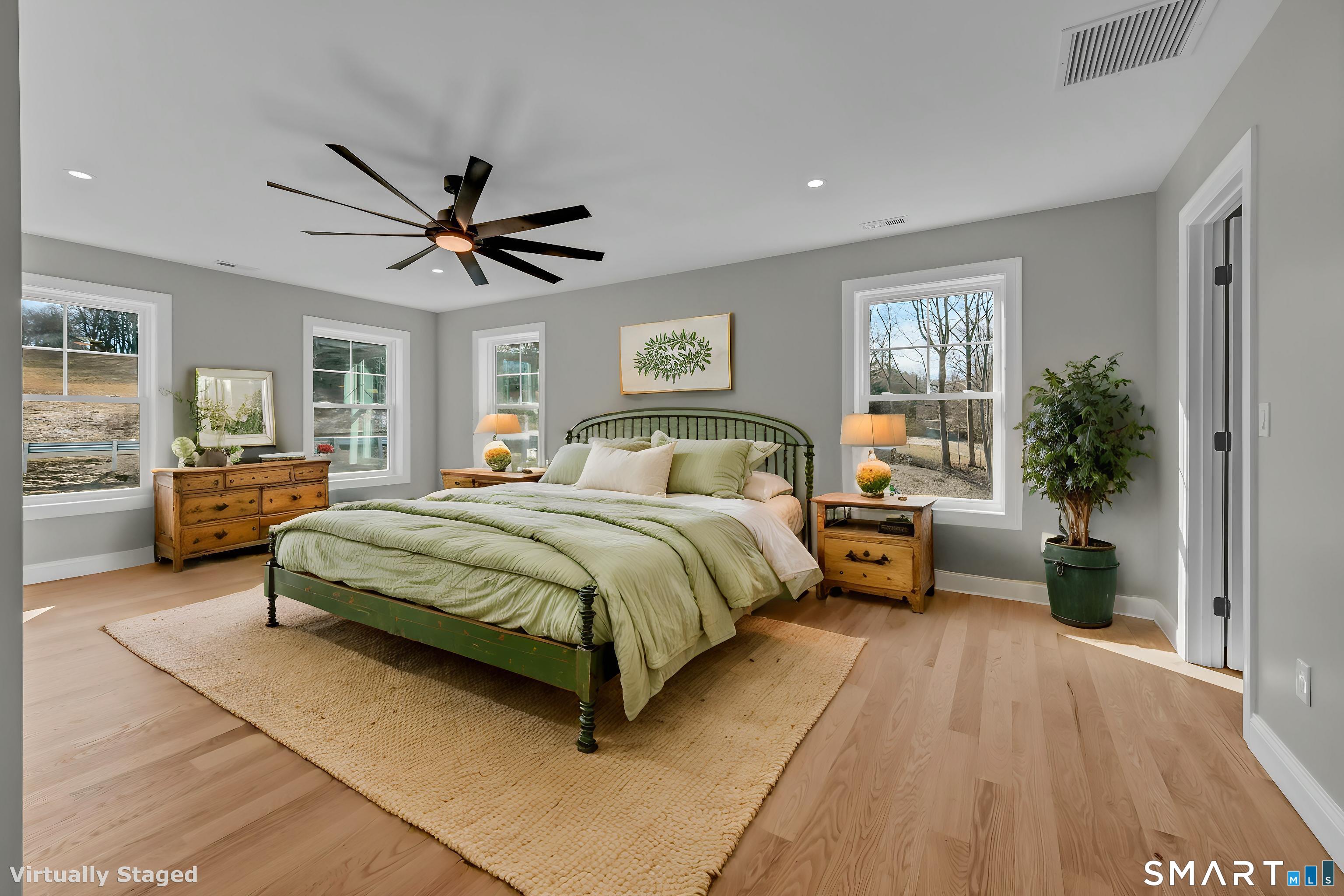 1427 Monroe Turnpike Monroe, CT 06468 - Photo 17 of 41 a spacious bedroom with a bed a couch and a window