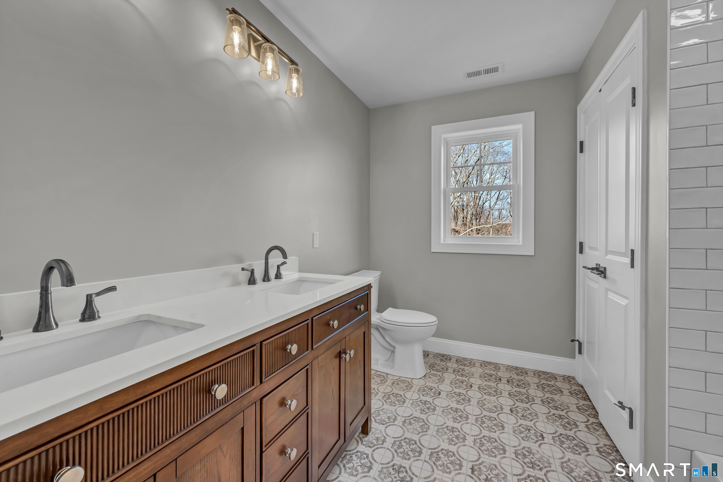 1427 Monroe Turnpike Monroe, CT 06468 - Photo 26 of 41 a bathroom with a sink a toilet and a mirror