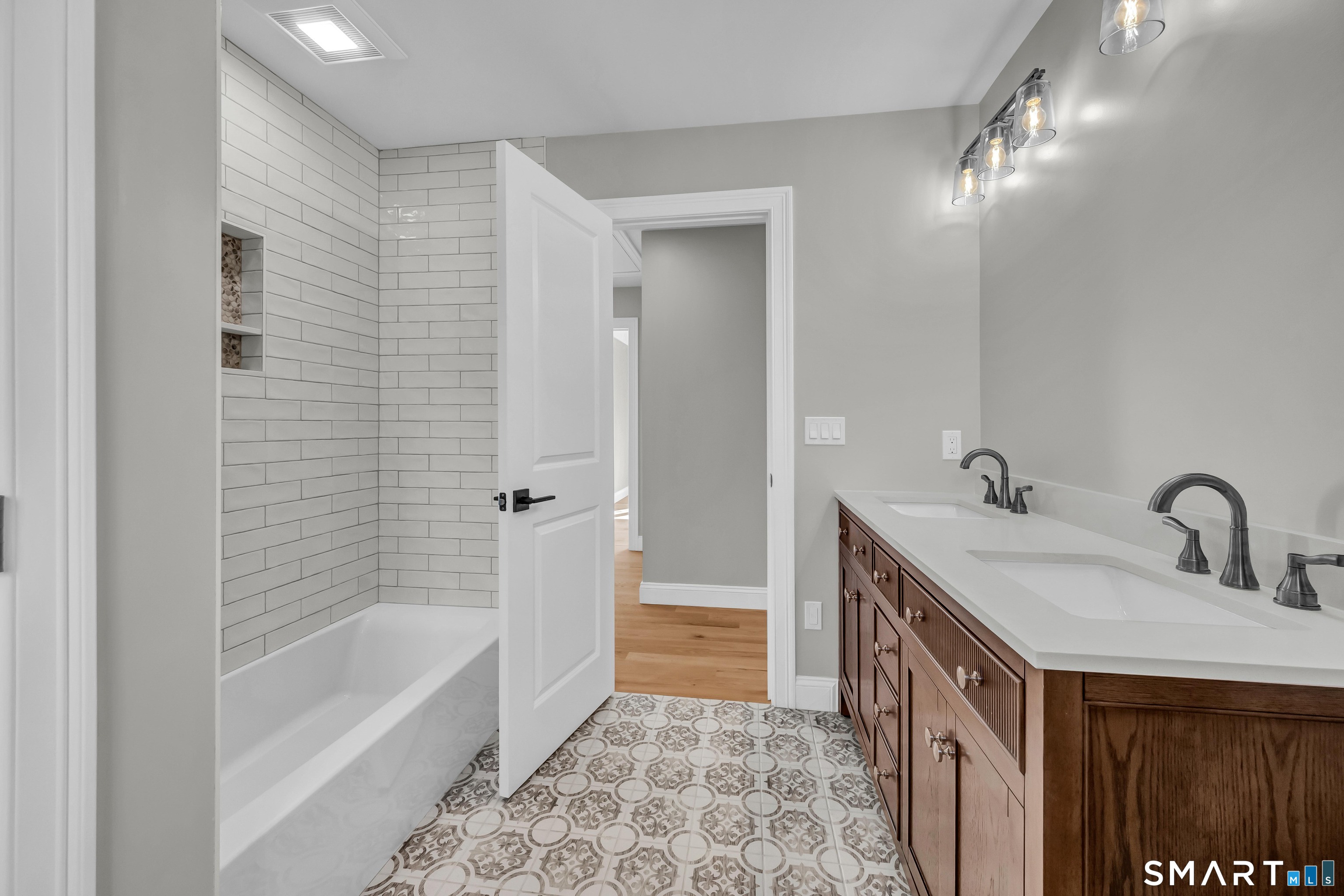 1427 Monroe Turnpike Monroe, CT 06468 - Photo 27 of 41 a bathroom with a sink a mirror and a bathtub