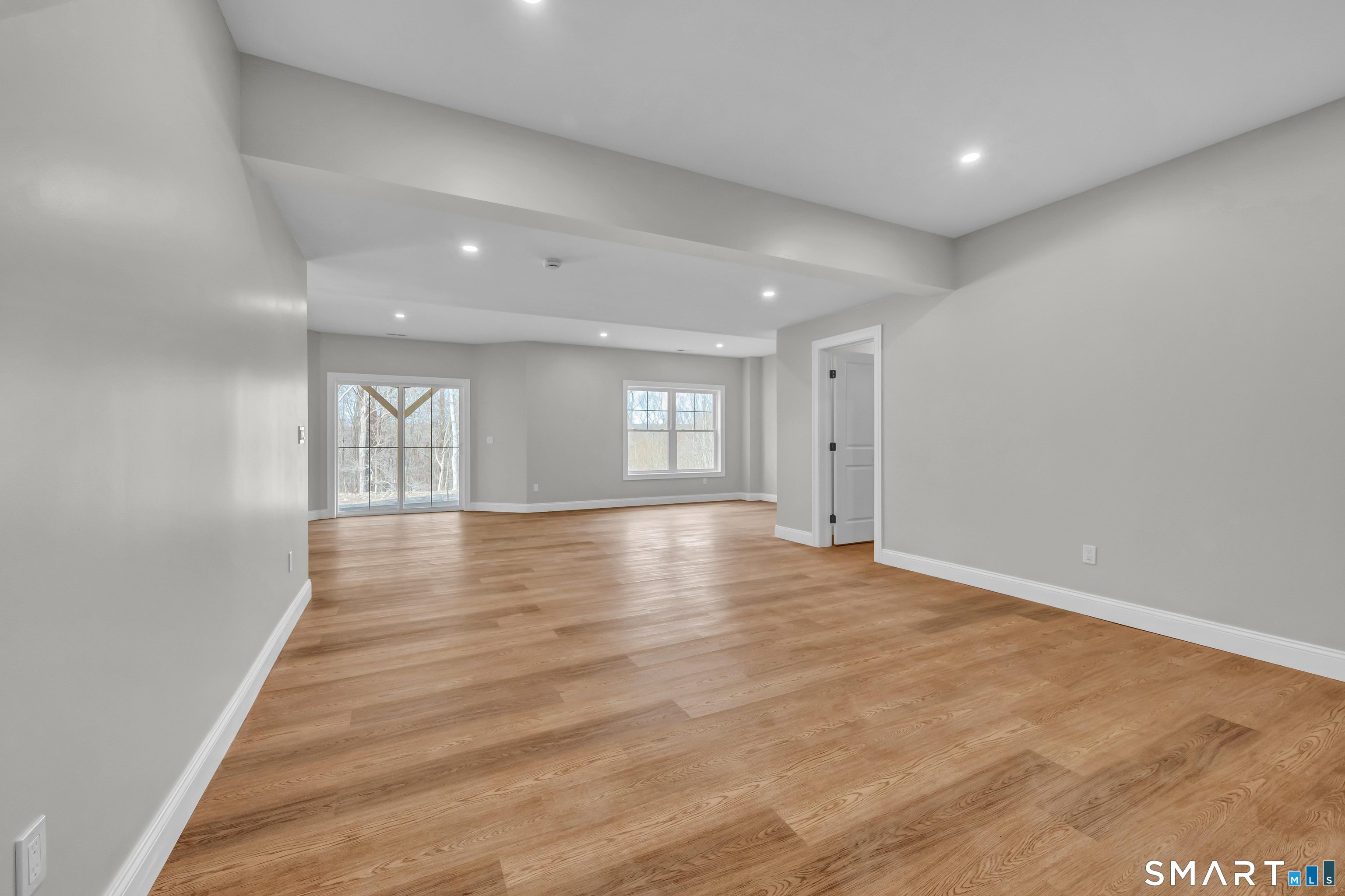 1427 Monroe Turnpike Monroe, CT 06468 - Photo 29 of 41 a view of empty room with wooden floor and fan