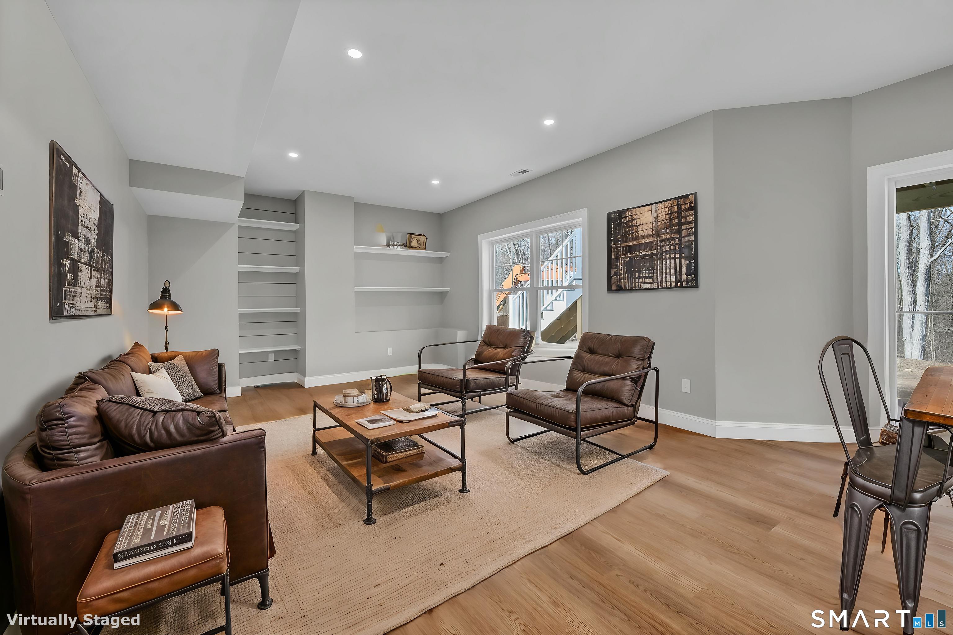 1427 Monroe Turnpike Monroe, CT 06468 - Photo 31 of 41 a living room with furniture and a wooden floor