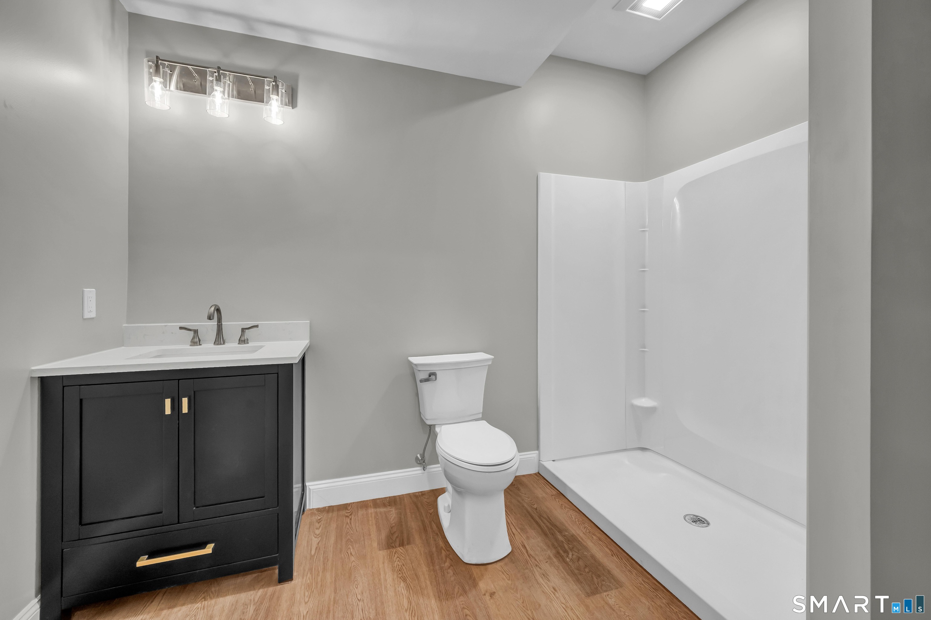 1427 Monroe Turnpike Monroe, CT 06468 - Photo 33 of 41 a bathroom with a sink a toilet and shower