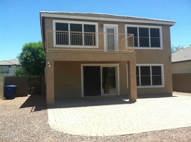 a black and white building with a large window