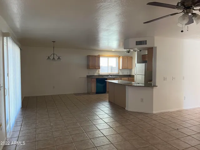 a large kitchen with cabinets and stainless steel appliances