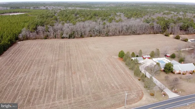 an aerial view of a houses with outdoor space