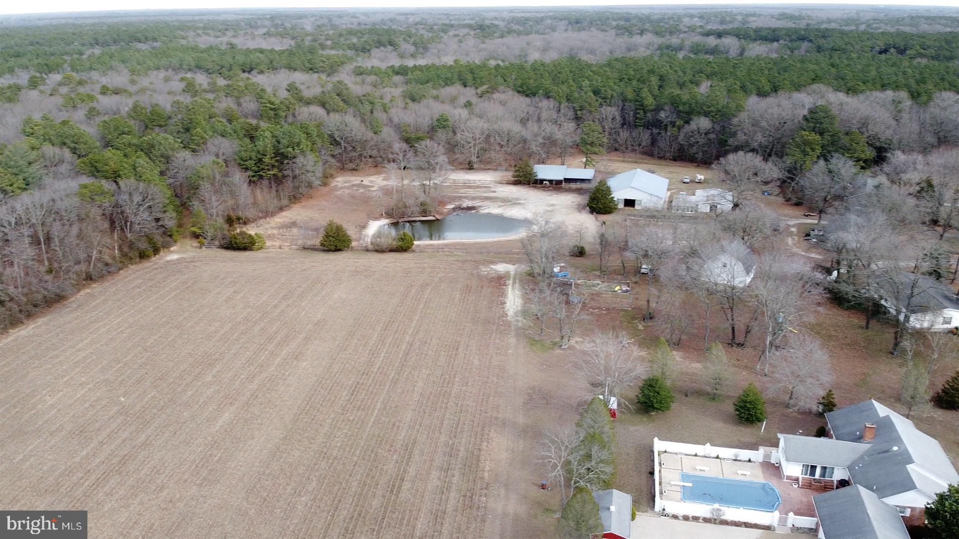 21063 Wilson Road Georgetown, DE 19947 - Photo 10 of 28 an aerial view of a houses with outdoor space