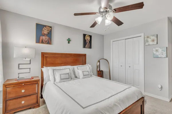 a bedroom with a bed and a dresser