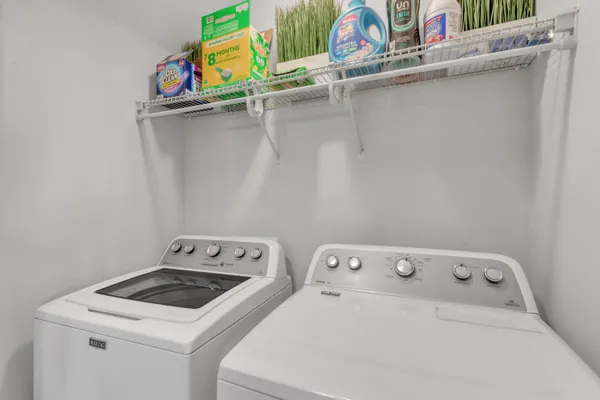 a utility room with dryer and washer
