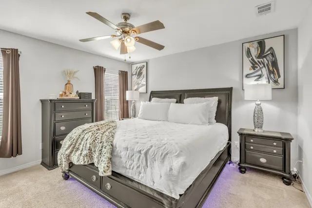 a bedroom with a bed and window