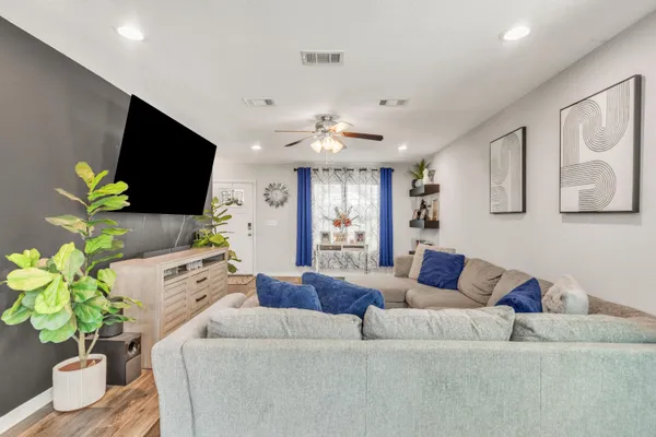 a view of a dining room with furniture wooden floor and chandelier