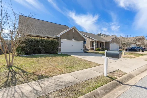 a front view of a house with a yard