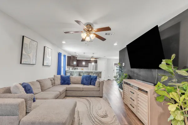 a living room with furniture and a flat screen tv