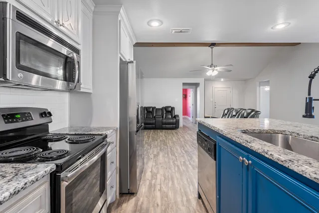 a kitchen with a stove and a microwave