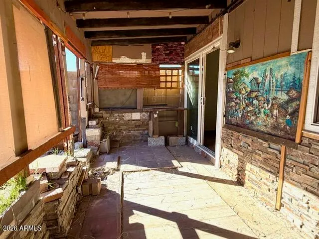 a room with lots of furniture and a rug