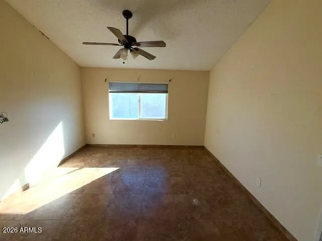 a view of an empty room and a window