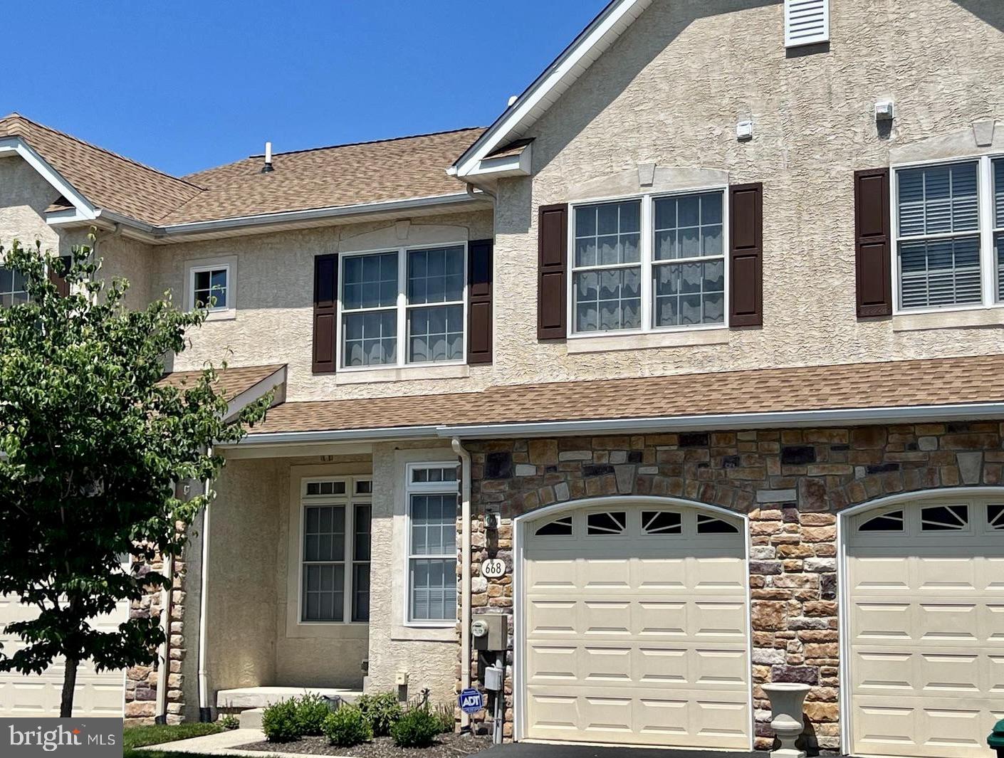 668 Greycliffe Lane Lower Gwynedd, PA 19002 - Photo 1 of 33 a view of a white house with large windows