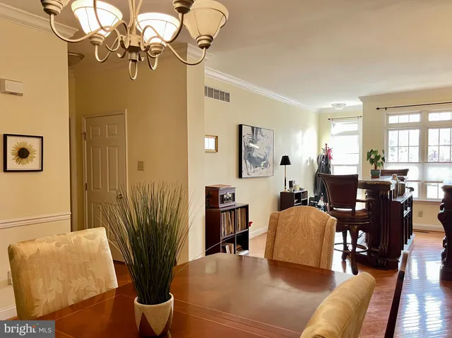 a living room with fireplace furniture and a wooden floor
